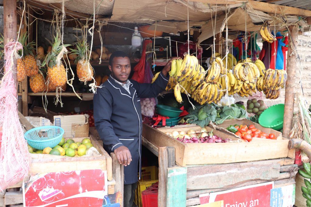 Joseph-Lowasa-Baraka-in-his-vegetable-and-fruit-kiosk-in-Nairobi-1-1024x683