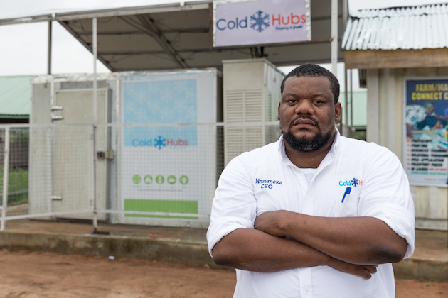 Social-entrepreneur-and-farmer-Nnaemeka-Ikegwuonu-posing-in-front-of-one-of-his-solar-powered-cold-rooms-credit-ColdHubs